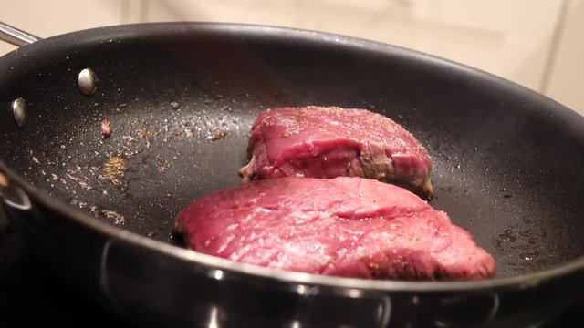 Steaks  in a frying pan