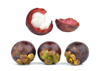 Mangosteen fruit and cross section showing the thick purple skin and white flesh of the queen of fruits.