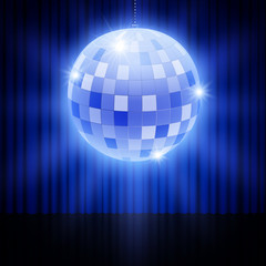 Mirror disco ball on stage curtain