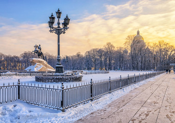 A partial view of Senate Square with the The Bronze Horseman and St.Isaac Cathedral on the background at a frosty winter day