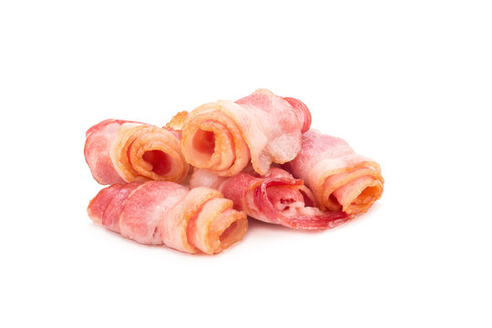 Cooked bacon rashers isolated on white