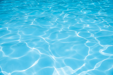 Obraz na płótnie Canvas Ripple Water in swimming pool witn sun reflection