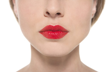 Close-up on an expressive female mouth with red lipstick