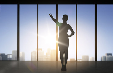 Fototapeta na wymiar silhouette of business woman pointing hand
