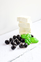 Fresh black olives and feta cheese. - obrazy, fototapety, plakaty
