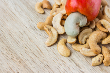 Cashew Nut Apple and Fresh Cashew Nut on wood