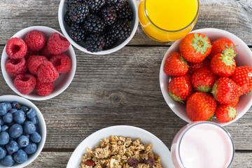 healthy breakfast with berries on wooden background, close-up