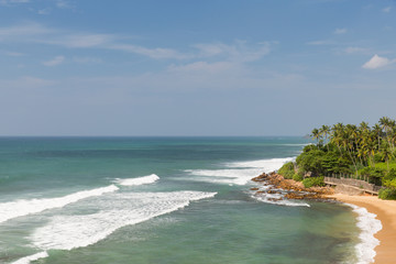 sea or ocean waves and blue sky on Sri Lanka beach