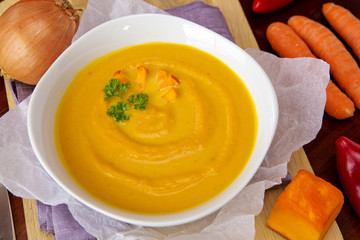 Fresh pumpkin soup with  vegetables .