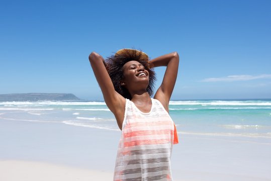 Attractive  young african woman enjoying a day at the beach