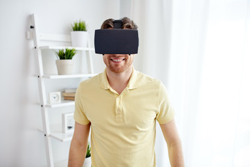 young man in virtual reality headset or 3d glasses