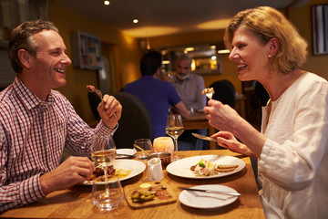 Senior couple having a meal together at a restaurant