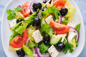 Greek salad isolated on white