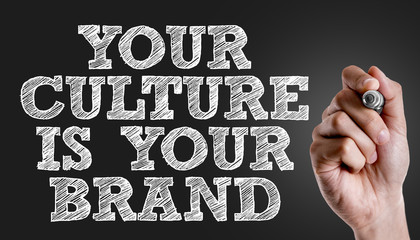 Hand writing the text: Your Culture is Your Brand
