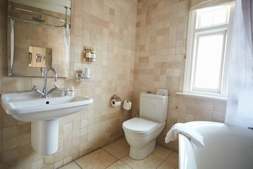 Fototapeta na wymiar Interior Of Contemporary Bathroom With Tiled Walls