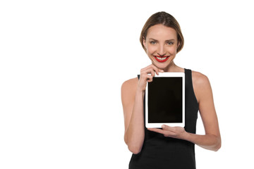 Young Caucasian woman showing a tablet with blank screen