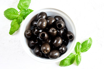 Fresh black olives and basil.