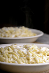 two plates of gnocchi gorgonzola and cream