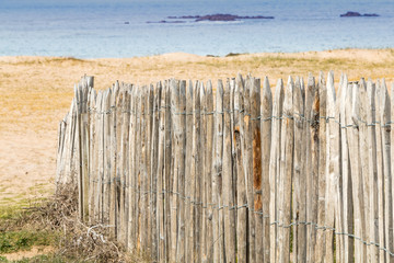 wooden palisade by the sea