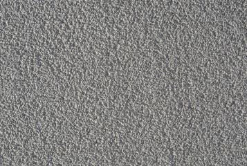 Gray stucco applied to an external building wall