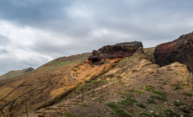 Tourists are climbing uphill on the Madeira east coast hiking path