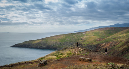 Tourists looking at the landscape of Madeira east coast.