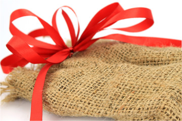 Jute sack present with red ribbon