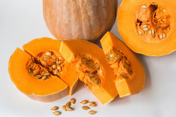 Pumpkin sliced on a white background, vegetarian food, organic, orange, health