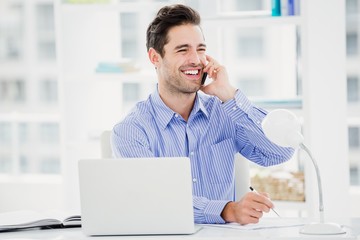 Fototapeta premium Businessman talking on mobile phone
