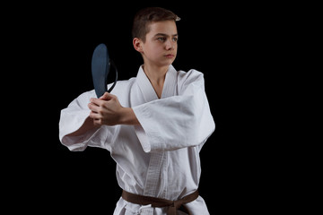 Karate Fighter in white Kimono Isolated on Black