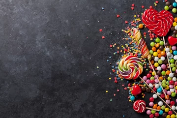 Photo sur Plexiglas Bonbons Colorful candies and lollipops over stone