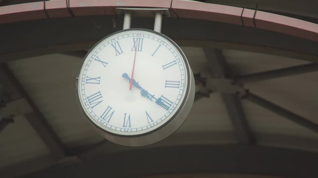 Close up shot of the public clock in a railway station