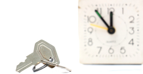 keys in front of vintage alarm clock