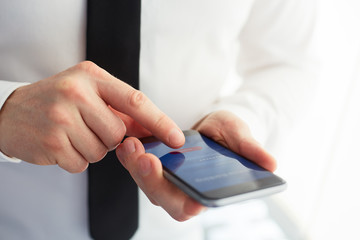 Male hands using mobile banking