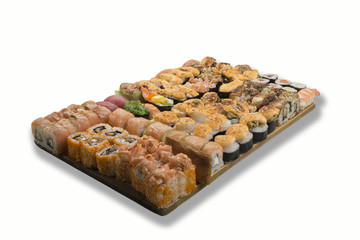 sushi and rolls on a wooden board