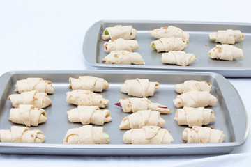 unbaked apples croissant on a white background 