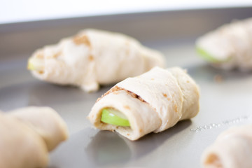 unbaked apples croissant on a white background 