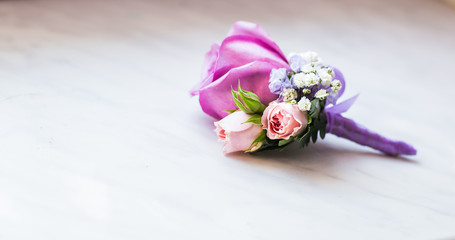 close-up of  Gentle groom's boutonniere 