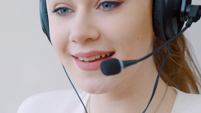 Portrait of young female customer service executive with headset 