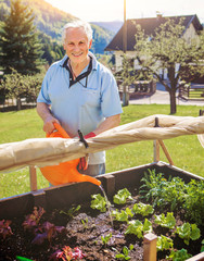 old man is working in his garden - gardening 21