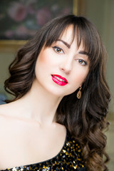 Beautiful face of young woman with clean skin and red lips