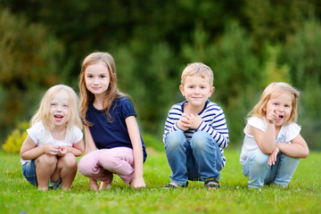 Fototapeta premium Four adorable little kids outdoors