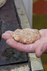 Grandmothers hand holding minced meat burger