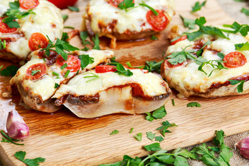 Cooked Mushrooms stuffed with cheese and plum tomatoes