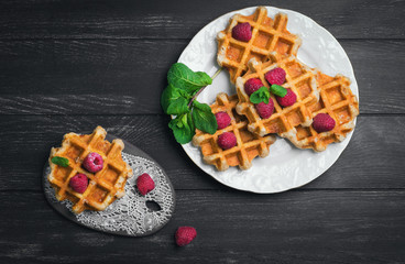 Belgian lush round waffles with fresh raspberries