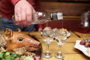 Person pouring vodka
