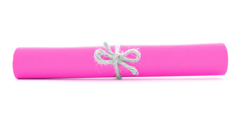 Pink paper scroll tied with string, single natural node isolated
