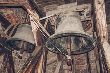 Obraz premium Two Old Church Bells in the Belfry Dark