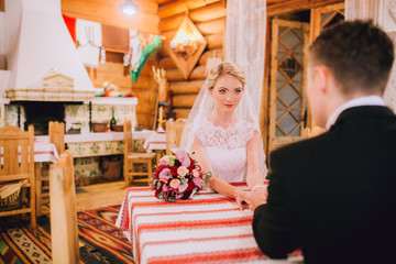 Just married couple embrace, wedding pair hugging, Bride and Groom, Romantic Married Couple in restaurant, holding hands, beautiful couple in the hotel , They Hug each other, wedding