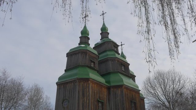 Three Towered Wooden Church Walls Panorama Green Roofs on a Bell Towers Winter Church of Paraskeva the Holy Martyr in Pirogovo Ukrainian Baroque Style